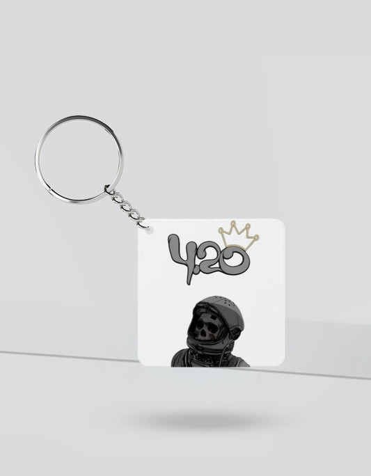 420 aesthetic keychain featuring a skull astronaut design with a crown on white background