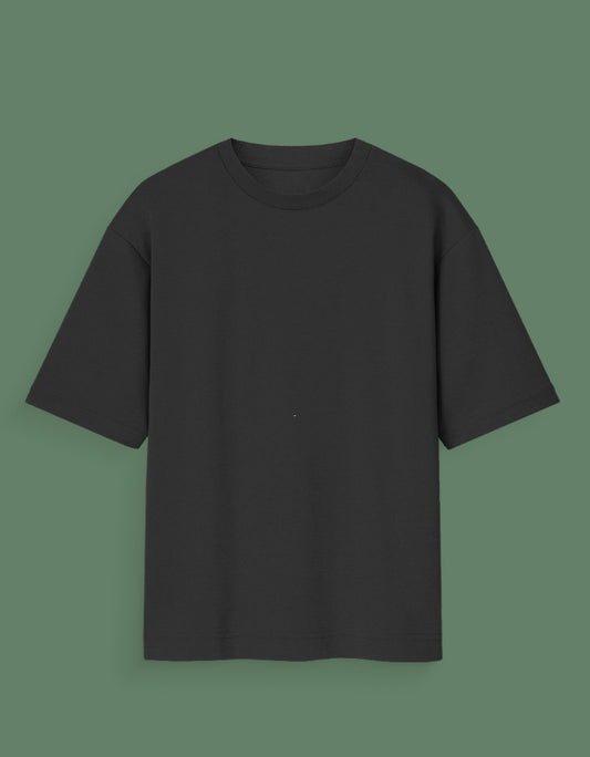 Black plain Custom Glow in dark T-shirt with short sleeves on green background