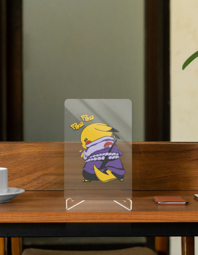 Pikachu Uchiha figure displayed on a wooden table, showcasing its playful design and vibrant colors