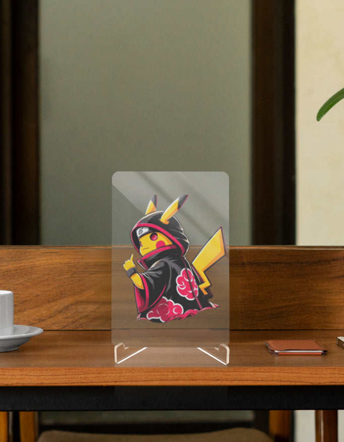 Pikachu figure in a black kimono with floral accents, displayed on a wooden table