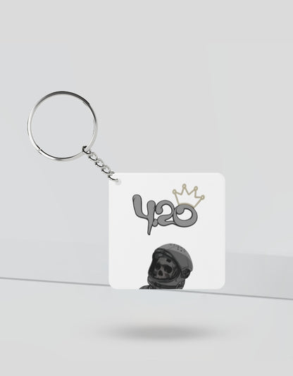 420 aesthetic keychain with a skull wearing a helmet and a crown design on white square background