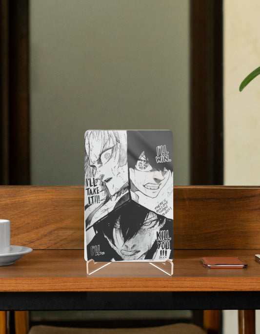 Black and white character relic featuring intense anime expressions on a display stand