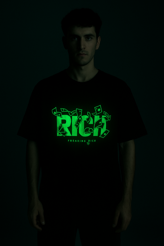 Black rich god anime aesthetic tee with glowing green graphic design on male model in dark background