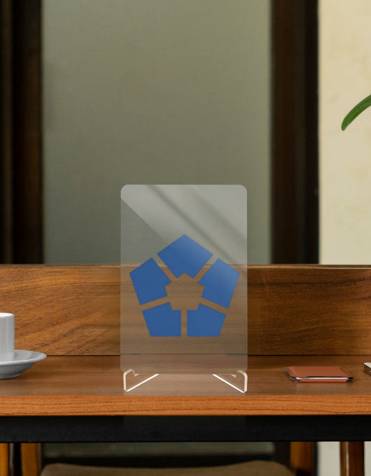 Transparent Character Relic Display Stand with Blue Logo on a Wooden Table