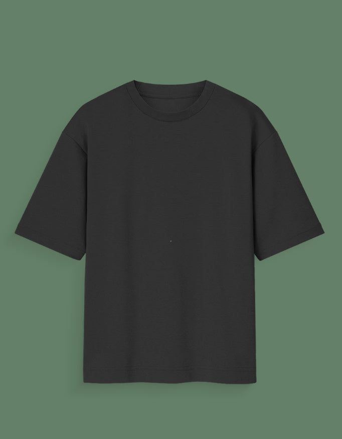 Black plain Custom Glow in dark T-shirt with short sleeves on green background