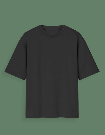 Black plain Custom Glow in dark T-shirt with short sleeves on green background