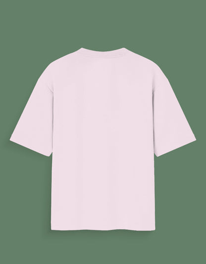 Back view of a plain light pink custom Glow in dark T-shirt with short sleeves on green background