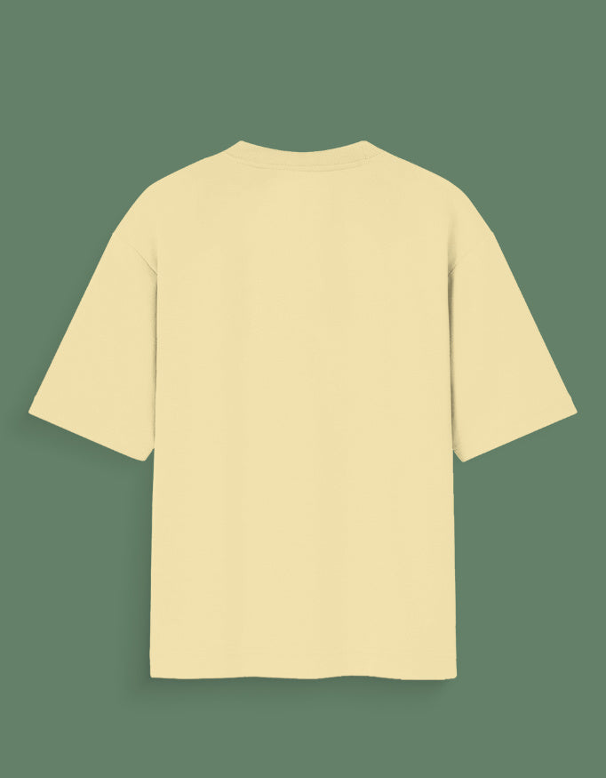 Back view of plain beige Custom Glow in dark T-shirt with short sleeves on green background