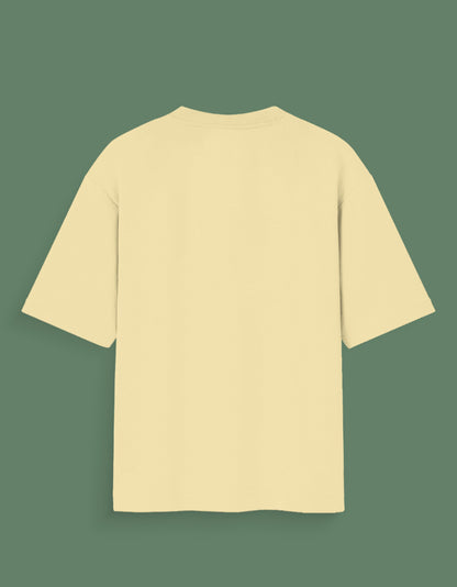 Back view of plain beige Custom Glow in dark T-shirt with short sleeves on green background