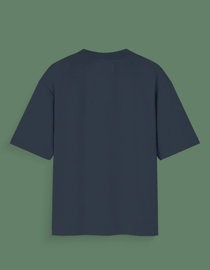 Back view of a plain navy blue Custom Glow in dark T-shirt with short sleeves on green background