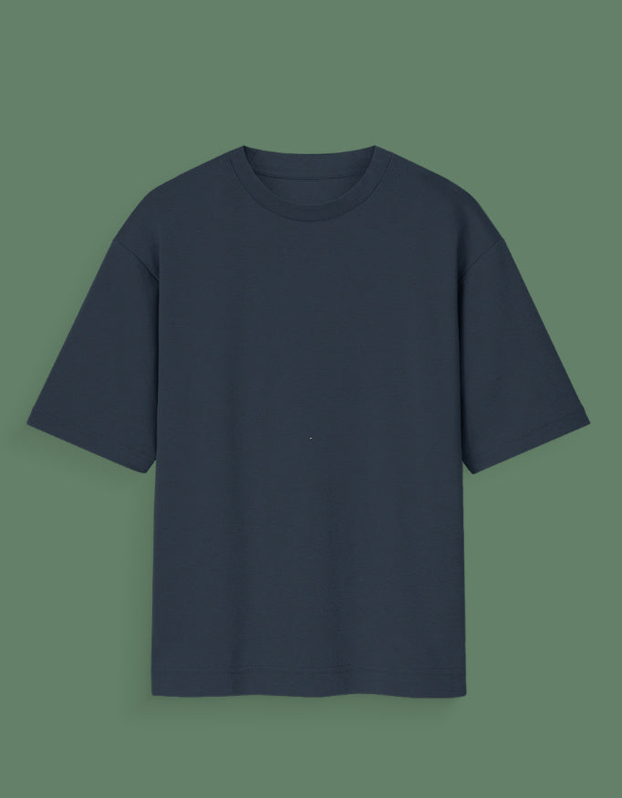 Plain black Custom Glow in dark T-shirt with short sleeves and a crew neck on green background