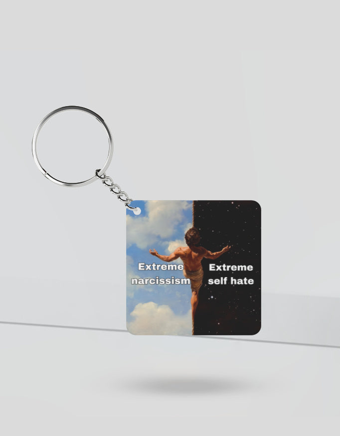 Extreme narcissism vs self hate keychain with artistic split design showing light and dark background