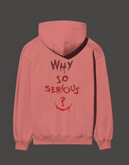 Pink hoodie featuring a graffiti style 'why so serious' design with a smiling face graphic