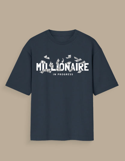 Navy blue millionaire in progress tee with white text and dollar bills graphic on front
