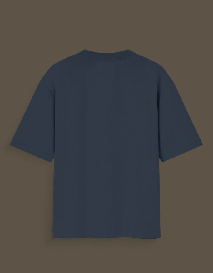 Plain navy blue Nika Glow t-shirt with short sleeves shown from the back