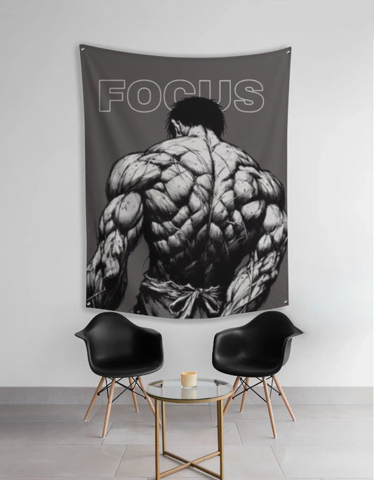 anime focus tapestry showing black and white muscular anime character back with FOCUS text hung above modern chairs and table