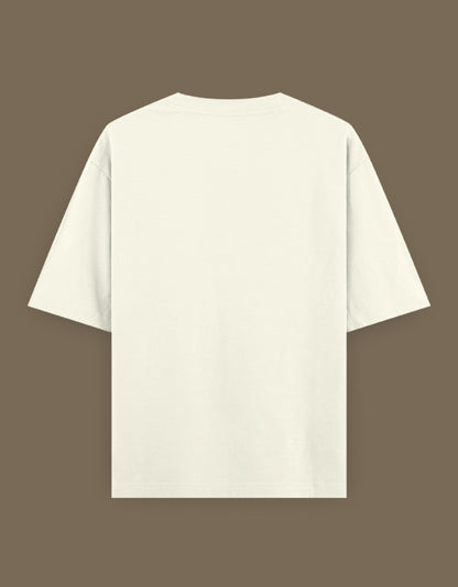 Back view of cream oversized Bachira anime t-shirt on brown background showing short sleeves and relaxed fit