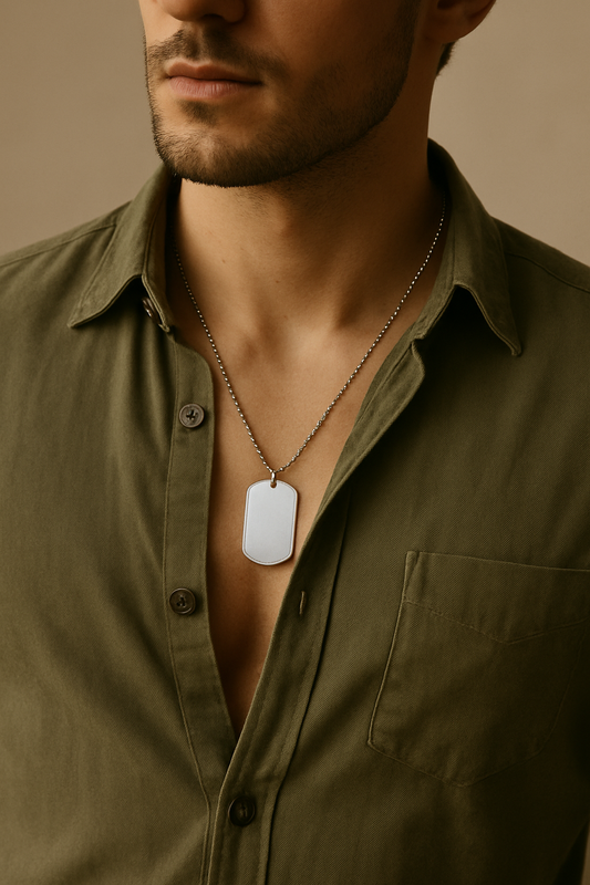 Man wearing a personalized otaku necklace with a silver dog tag pendant on a ball chain
