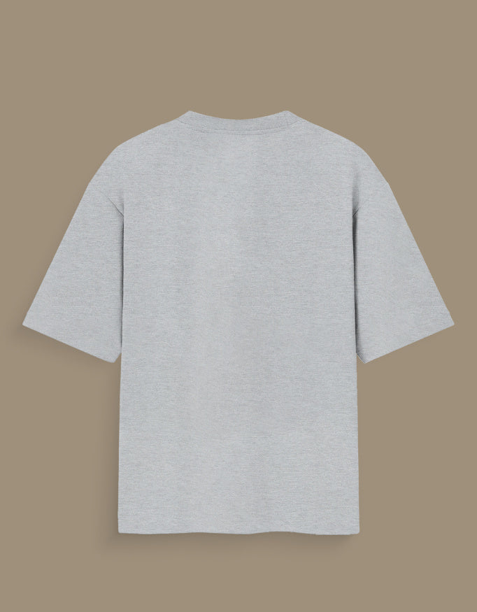 Plain light gray personalized oversized T-shirt India with short sleeves displayed on brown background