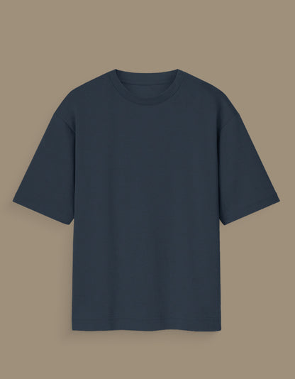 Personalized oversized T-shirt India with shadow graphic and monarch text on dark fabric