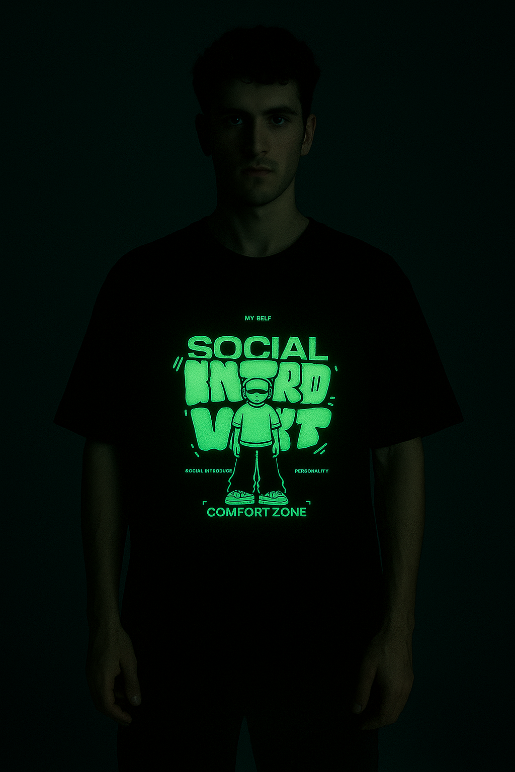 Social Introvert glow in the dark t-shirt with neon graphic design worn by a male model in dark