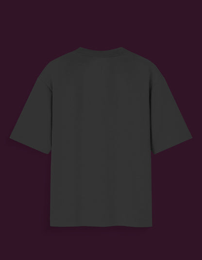 Black plain sukuna glow in the dark t-shirt shown from the back on a dark background