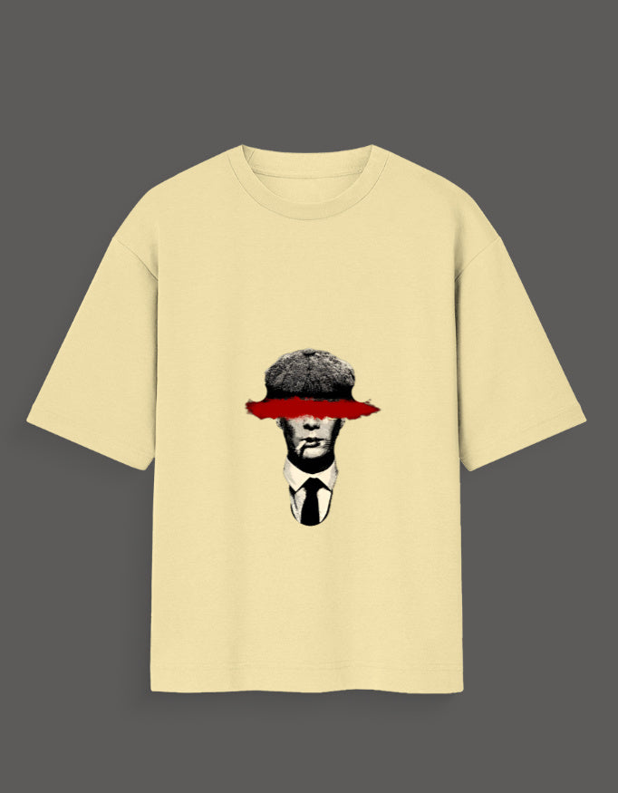 Beige Thomas Shelby graphic tee featuring a black and white illustration with red eye cover