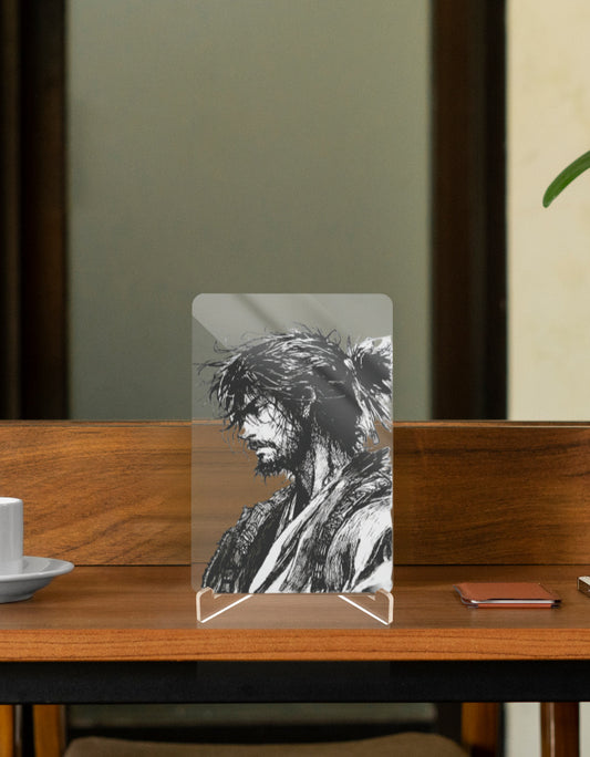 Vagabond character relic collectible on a wooden table with a coffee cup and phone